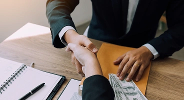 Business loan approval and agreement handshake
