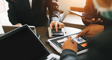 Debt management consultation reviewing monthly finances